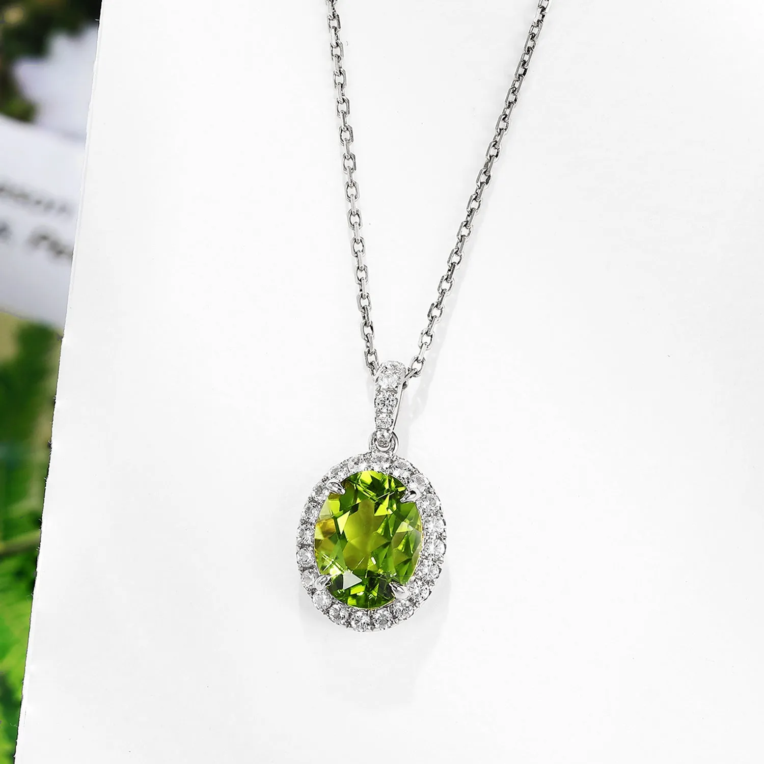 Oval Peridot Pendant with White Sapphire Halo