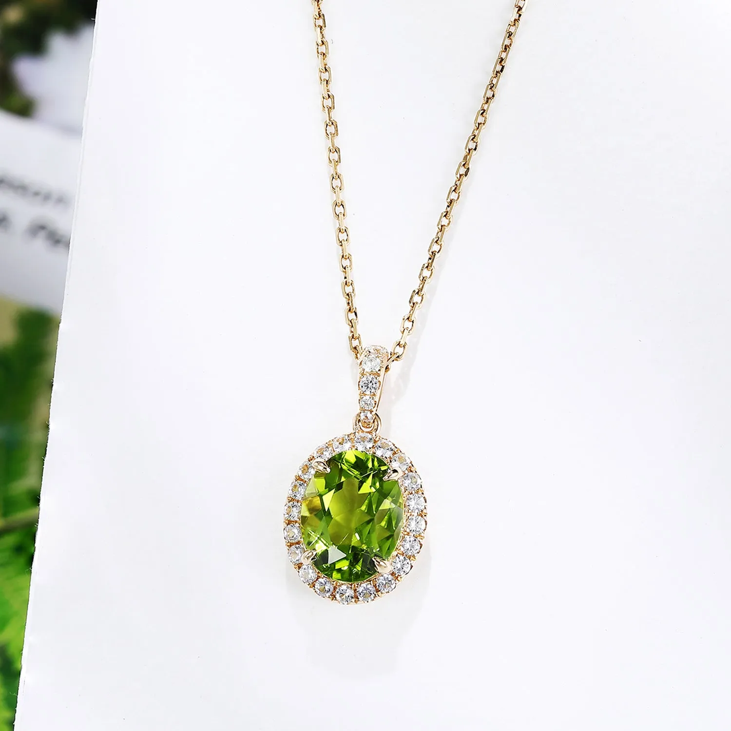 Oval Peridot Pendant with White Sapphire Halo