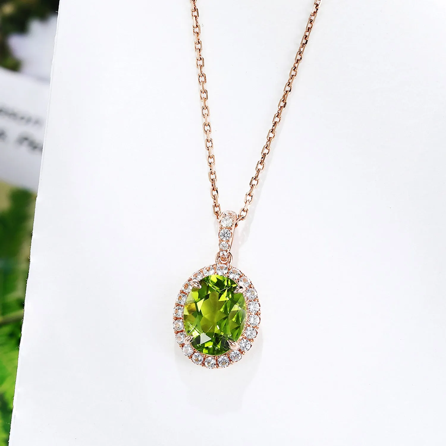 Oval Peridot Pendant with White Sapphire Halo